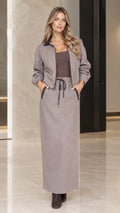 Front full view of woman wearing Taupe Gray two-piece jacket and maxi skirt set