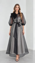 Full front view of model wearing Charcoal Grey organza collared maxi shirt dress with black sash and 3D floral shoulder detail