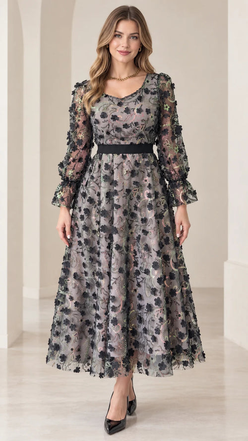 Front view of model wearing gray 3D floral appliqué sequin midi dress with long sleeves