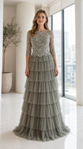 Front view of model wearing Sage Green beaded bodice tiered tulle maxi dress
