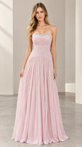 Front full view of woman wearing a strapless blush pink chiffon evening gown with beaded neckline