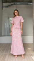 Front view of model wearing pink floral embroidered short-sleeve top and maxi skirt set