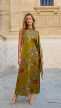 Front view of model wearing olive green one-shoulder floral print maxi dress with draped cape sleeve