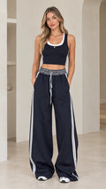 Front view of model wearing Navy Blue crop tank and wide-leg track pants set