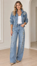 Model wearing light blue floral embellished denim jacket and wide-leg jeans two-piece set, full front view