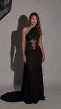 Front view of black one-shoulder evening gown with beaded sheer illusion waist and train