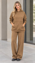 Front view of woman wearing camel fleece hoodie and wide-leg sweatpants matching lounge set