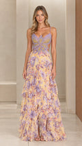 Front view of woman wearing pastel yellow floral chiffon maxi dress with beaded butterfly bodice