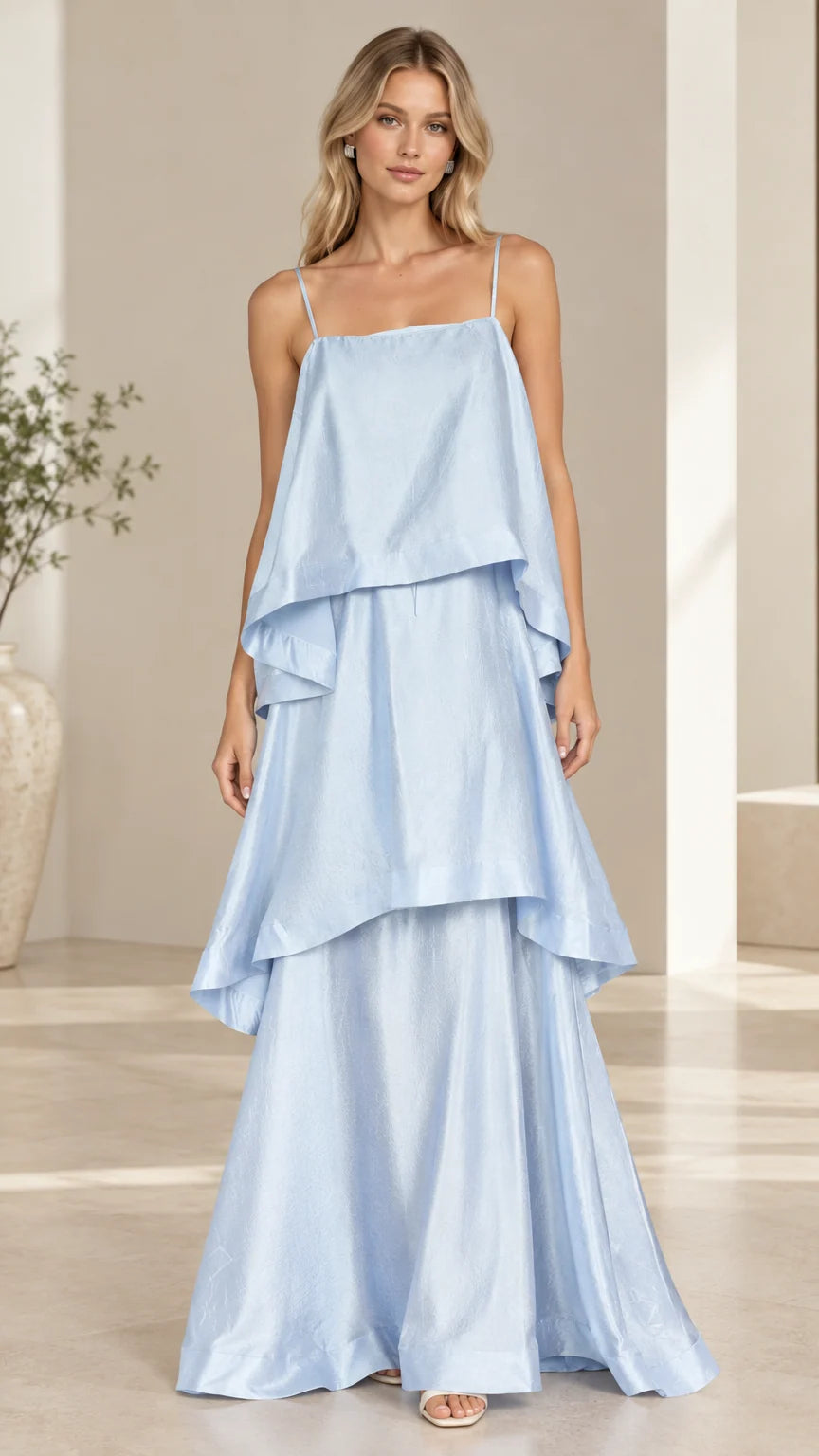 Model wearing light blue tiered cami maxi dress front view