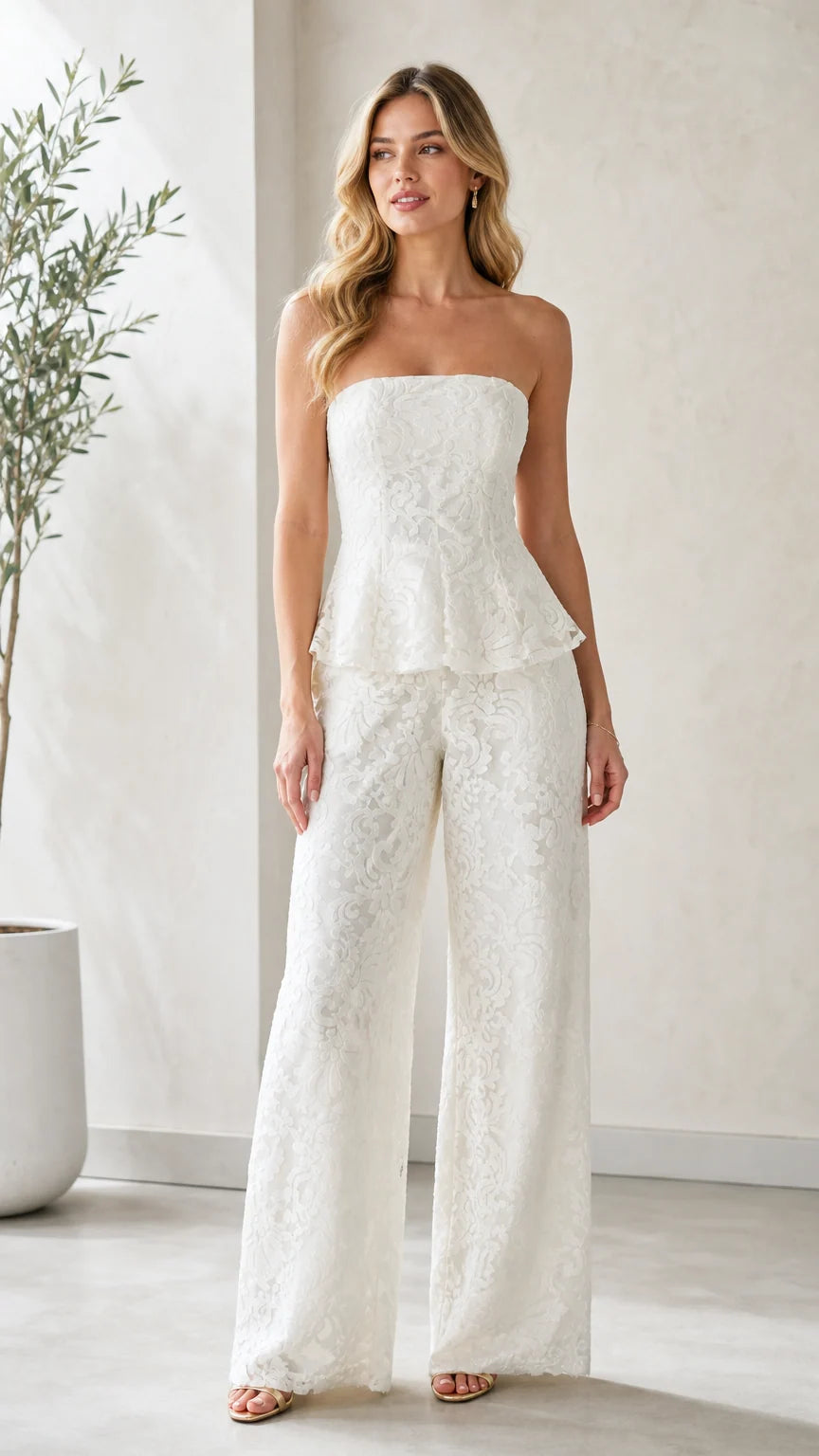 Model wearing white strapless lace peplum wide leg jumpsuit front view