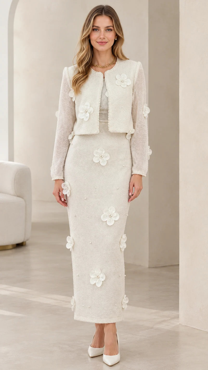 Full front view of model wearing ivory tweed cropped jacket and maxi skirt set with 3D floral appliques