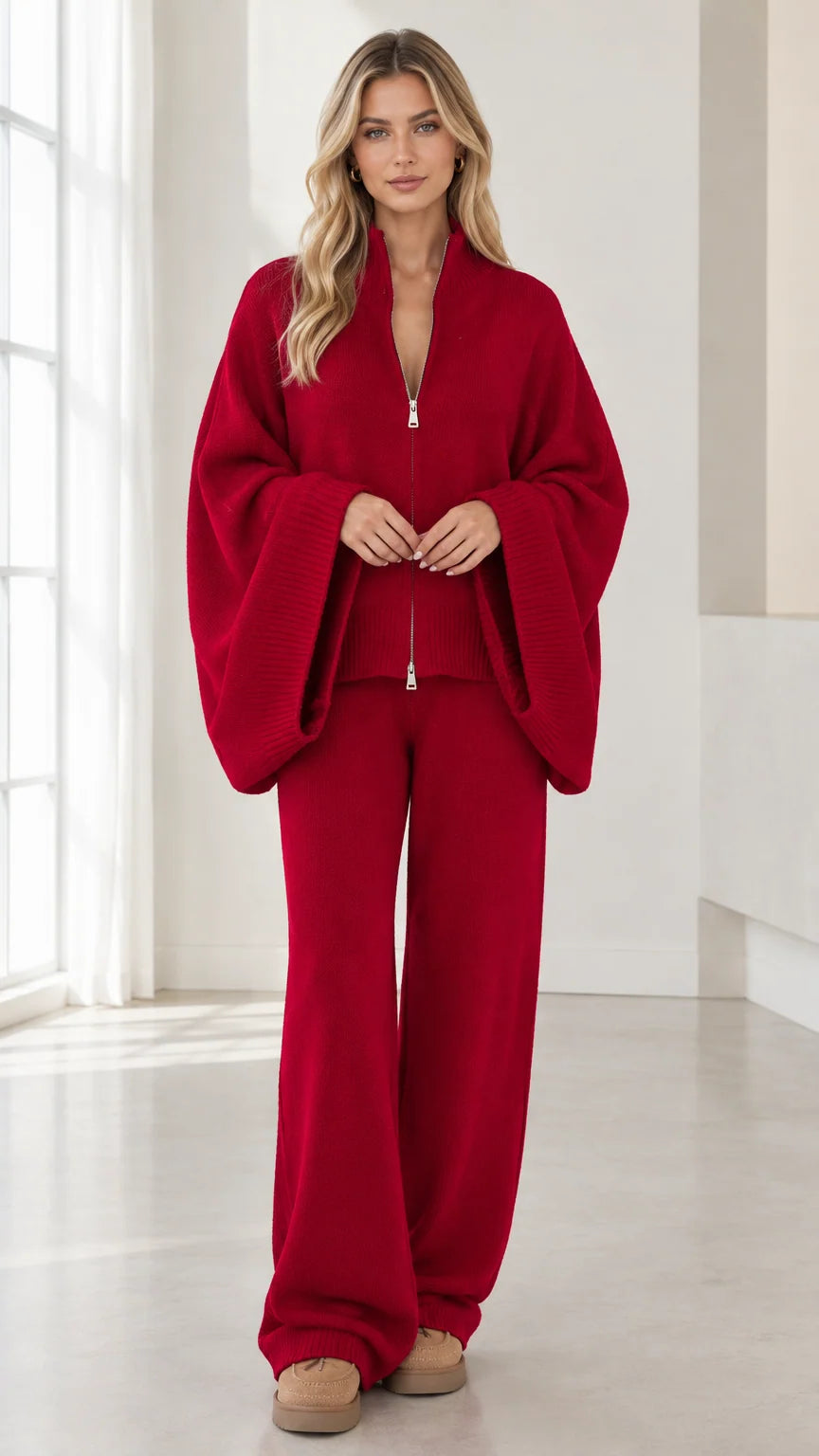 Front view of woman wearing Red knit zip-up wide sleeve cardigan and wide-leg pants set