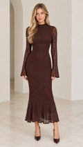 Front full-length view of woman wearing chocolate brown lace mock neck mermaid dress