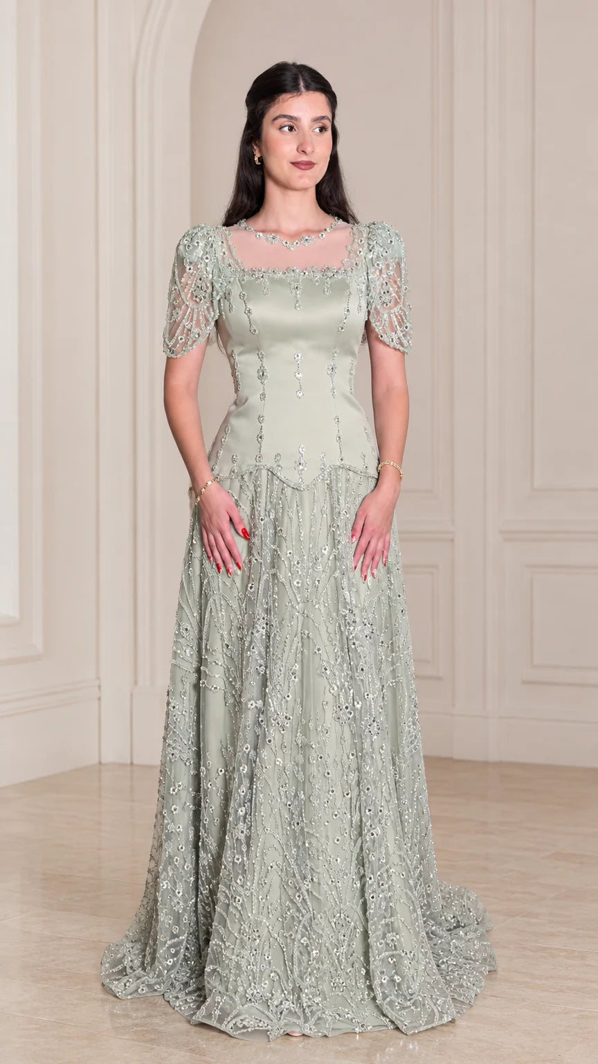 Front view of model wearing Sage Green beaded short sleeve evening gown