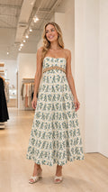 Front view of model wearing white floral tiered maxi dress