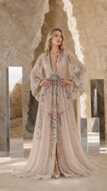Front view of Champagne embroidered beaded long sleeve evening gown