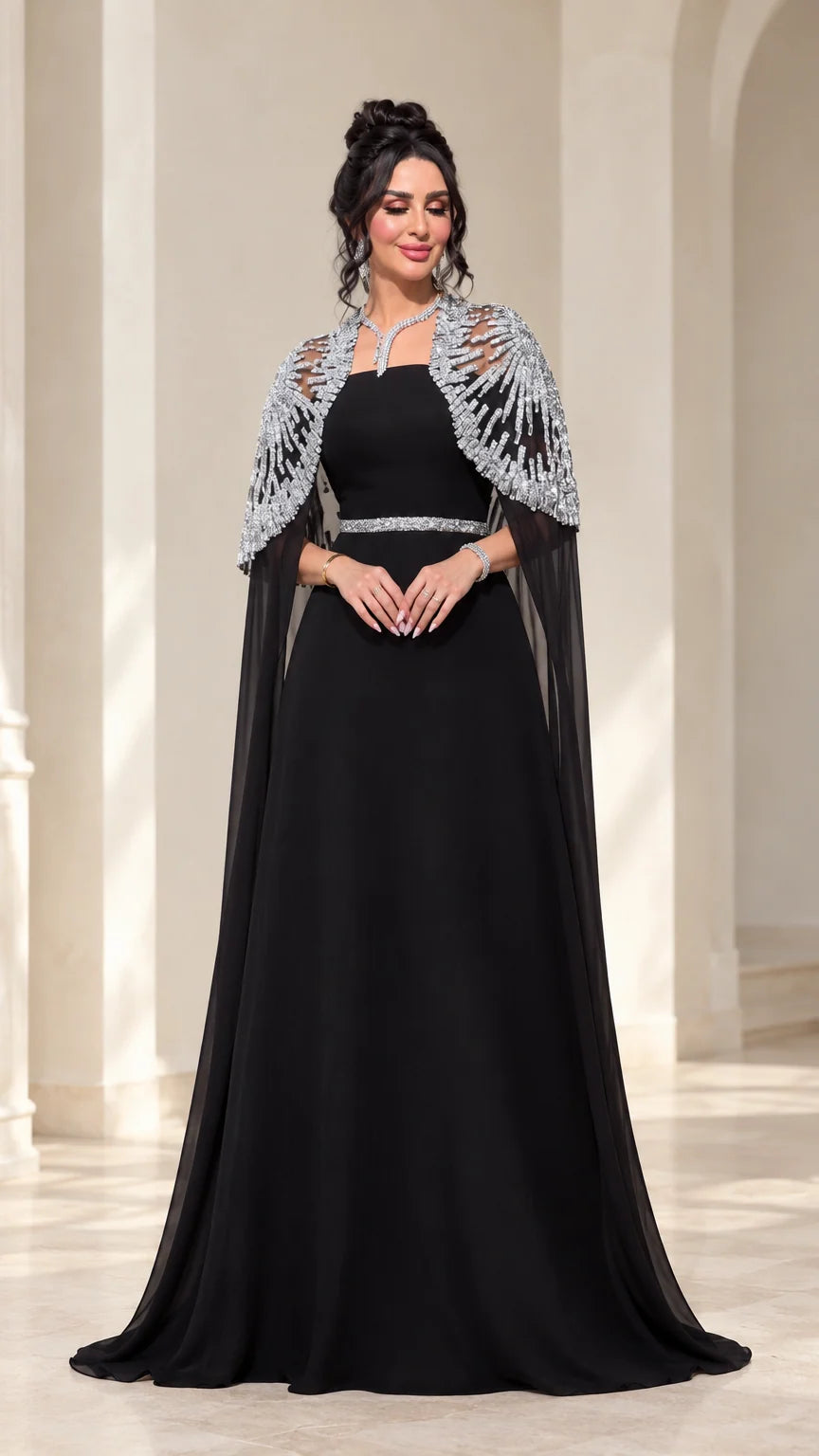 Black floor-length evening gown with silver beaded sheer cape overlay front view