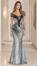Front view of model wearing full-length silver sequin peplum mermaid evening gown