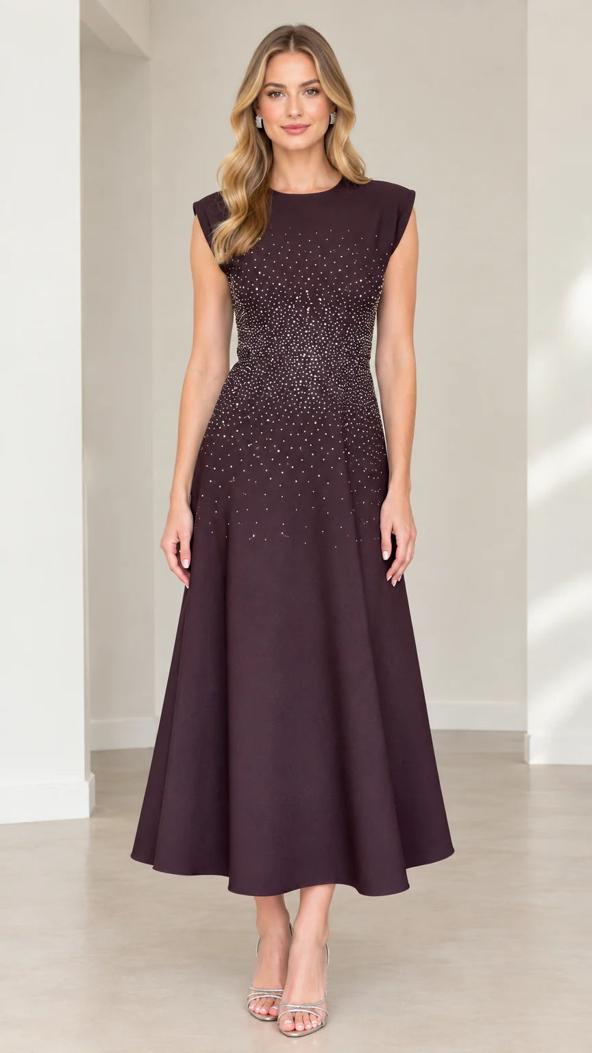 Front view of model wearing plum cap sleeve rhinestone embellished A-line midi dress