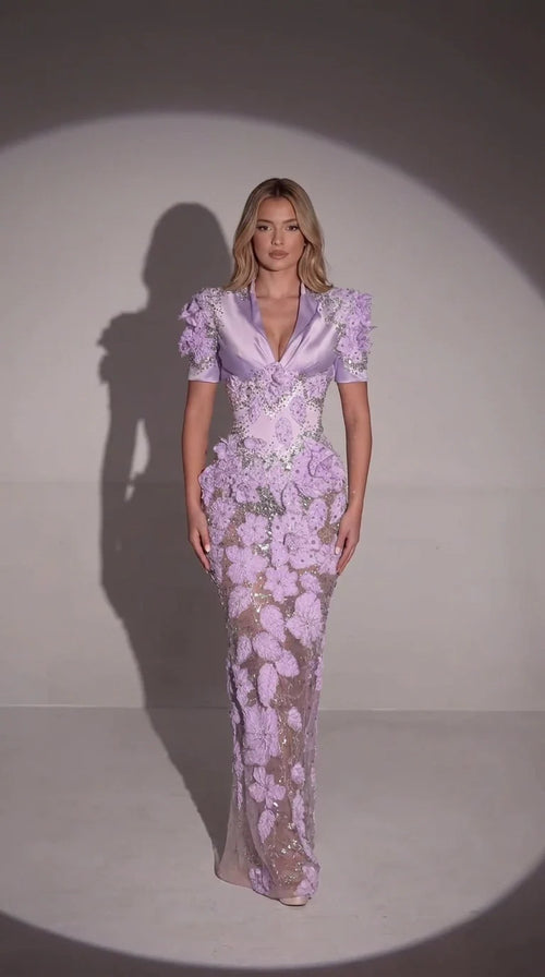 Front full-length view of model wearing lavender 3D floral embellished evening gown