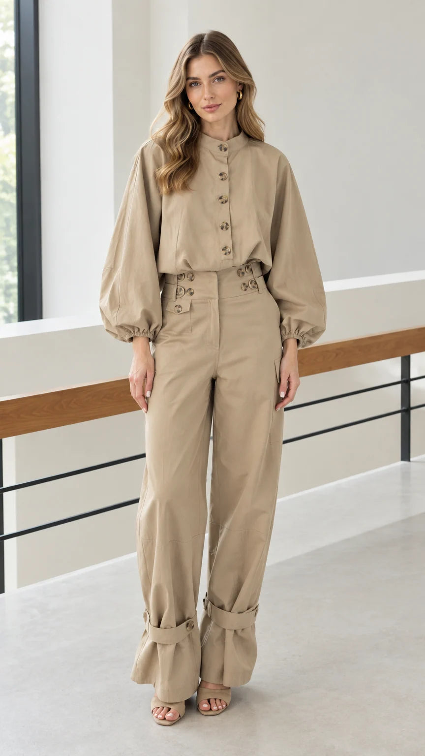 Front full view of woman wearing khaki utility two-piece blouse and wide leg pants set
