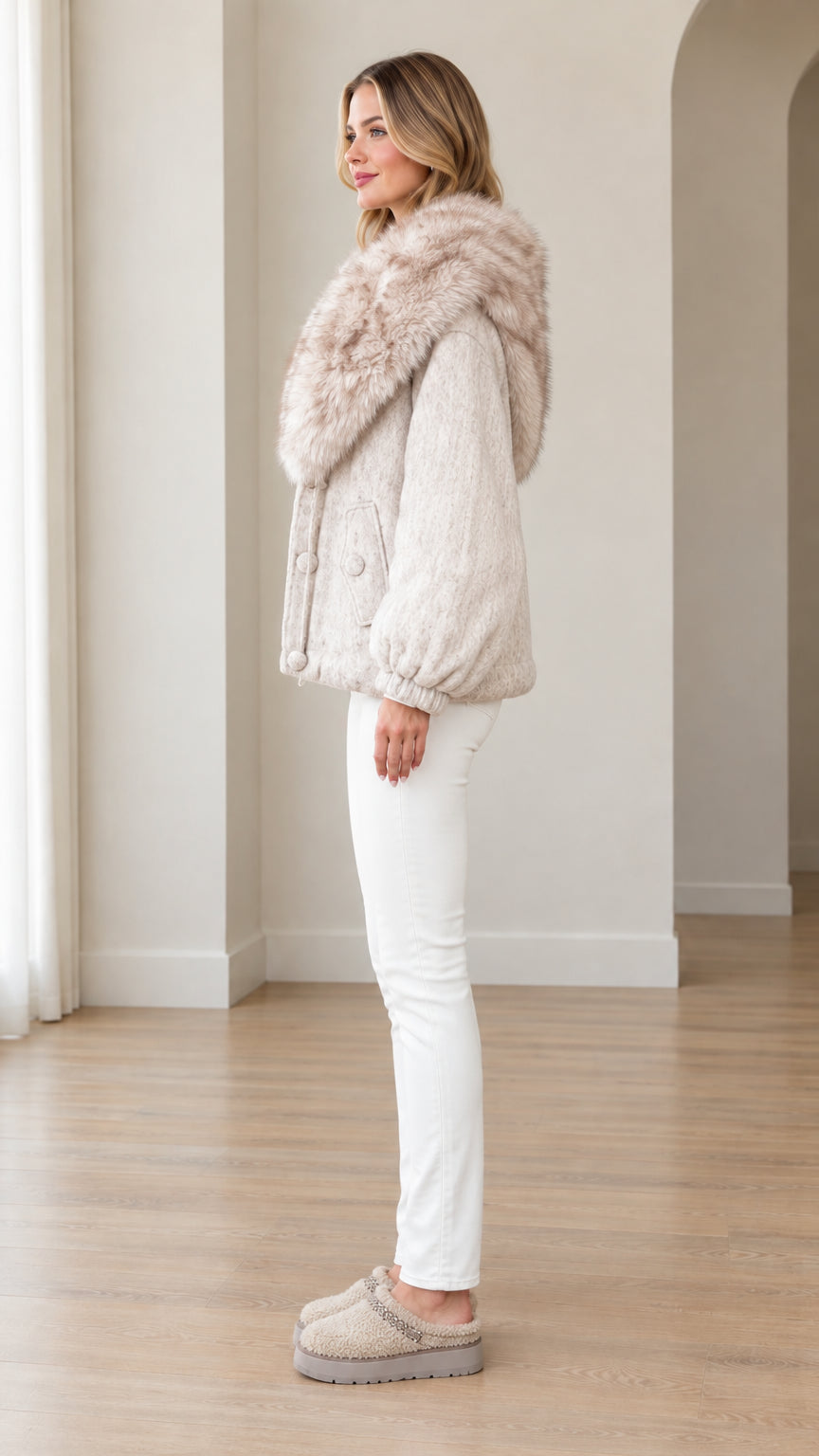 Side profile view of oatmeal faux fur hooded winter jacket