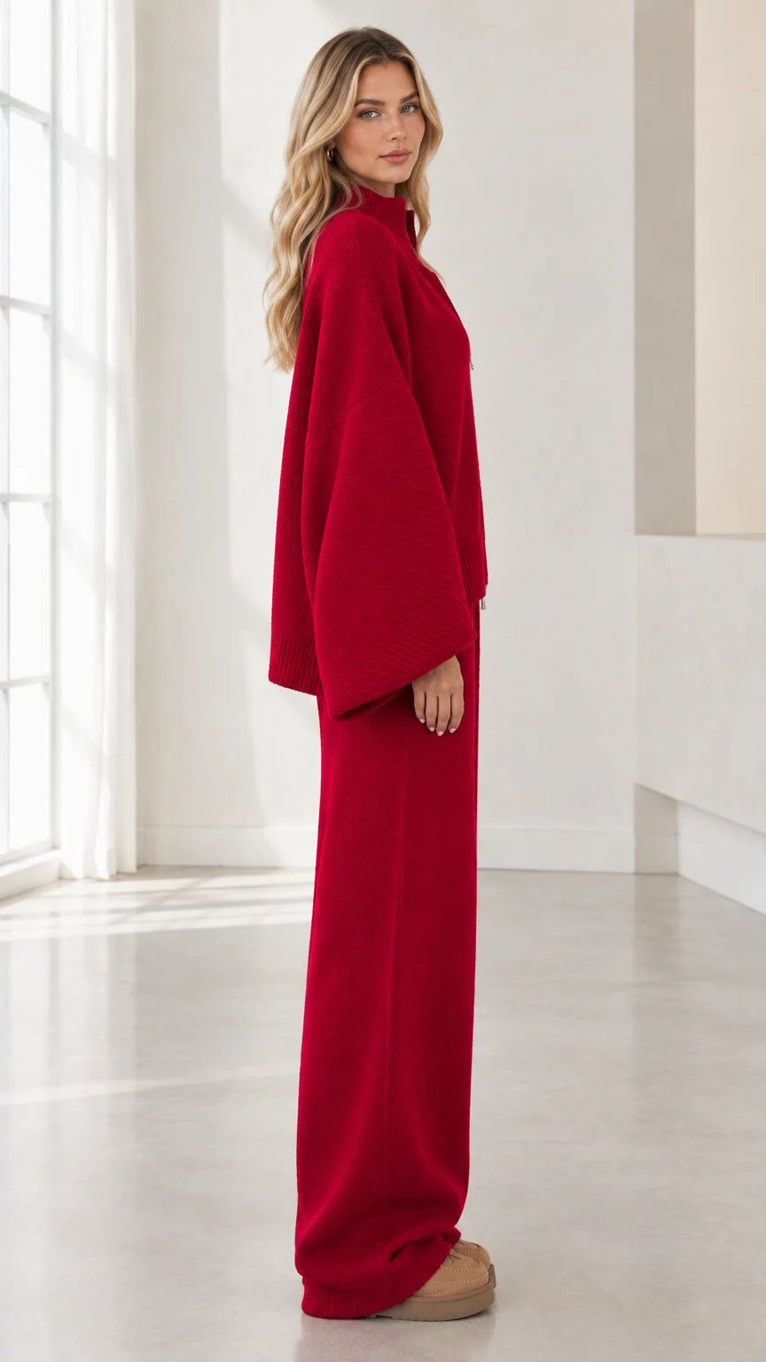 Side profile view of woman wearing Red knit lounge set with wide sleeves