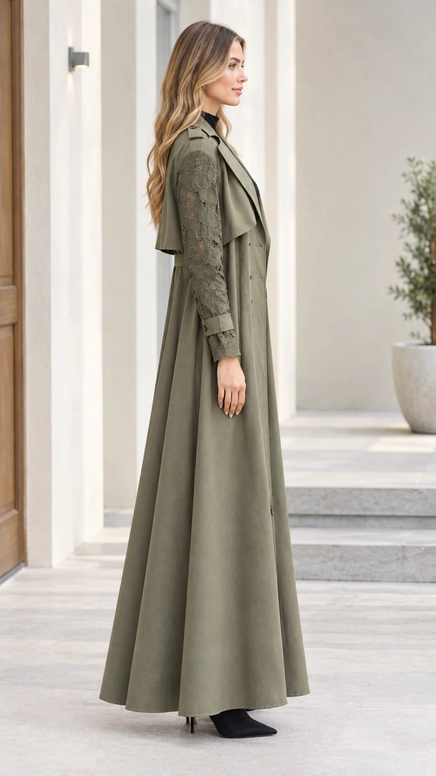 Side profile view of olive green floor-length belted trench coat with floral lace sleeves