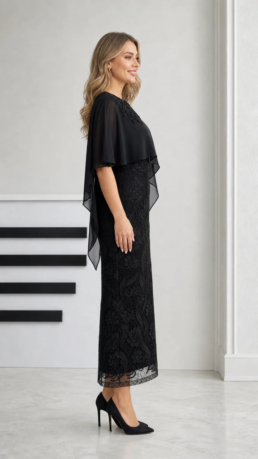 Side profile view of black formal capelet lace evening dress