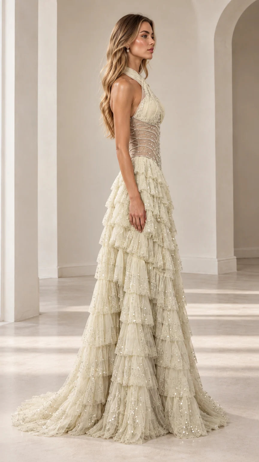 Side profile view of Champagne halter tiered sequin formal gown