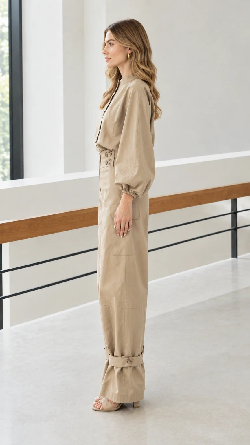 Side profile of woman in khaki lantern sleeve top and matching cargo trousers