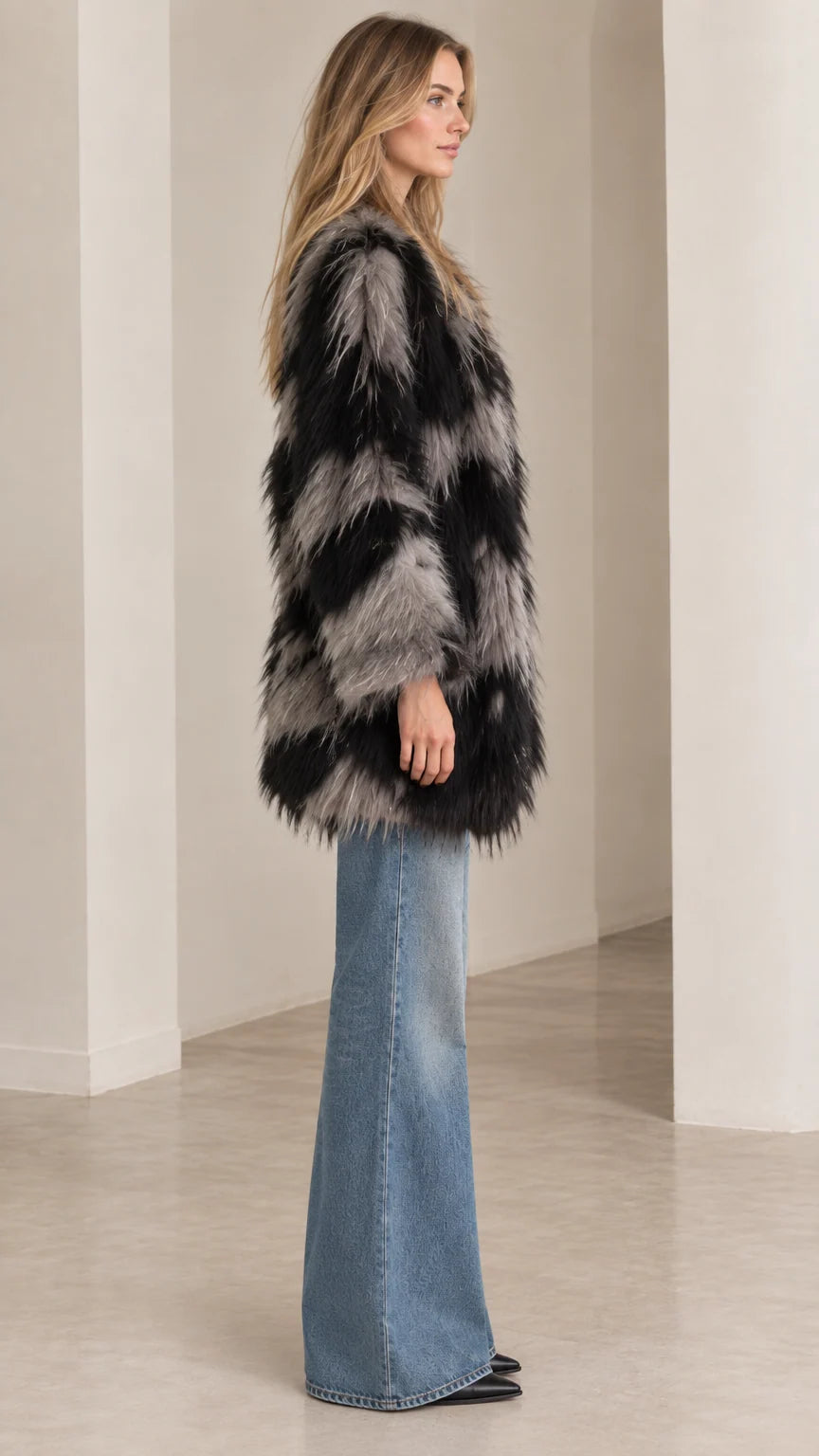 Side profile view of black and grey chevron fluffy faux fur jacket
