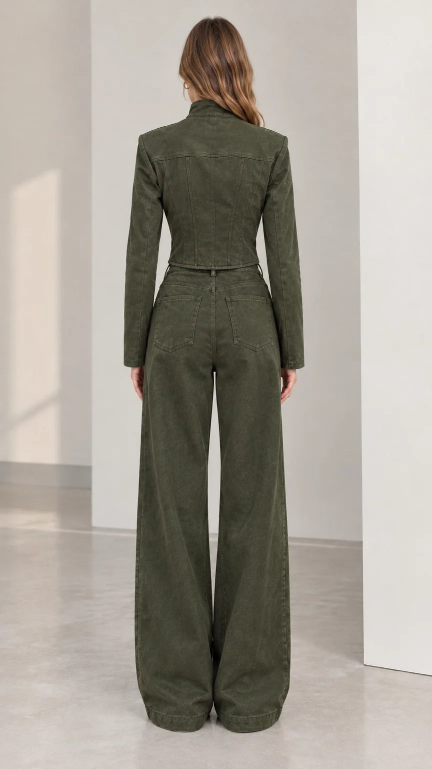 Back view of women's olive green cropped structured jacket and wide leg trousers