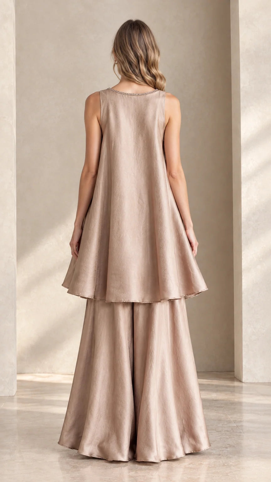 Back view of champagne two-piece tunic and palazzo trouser ensemble
