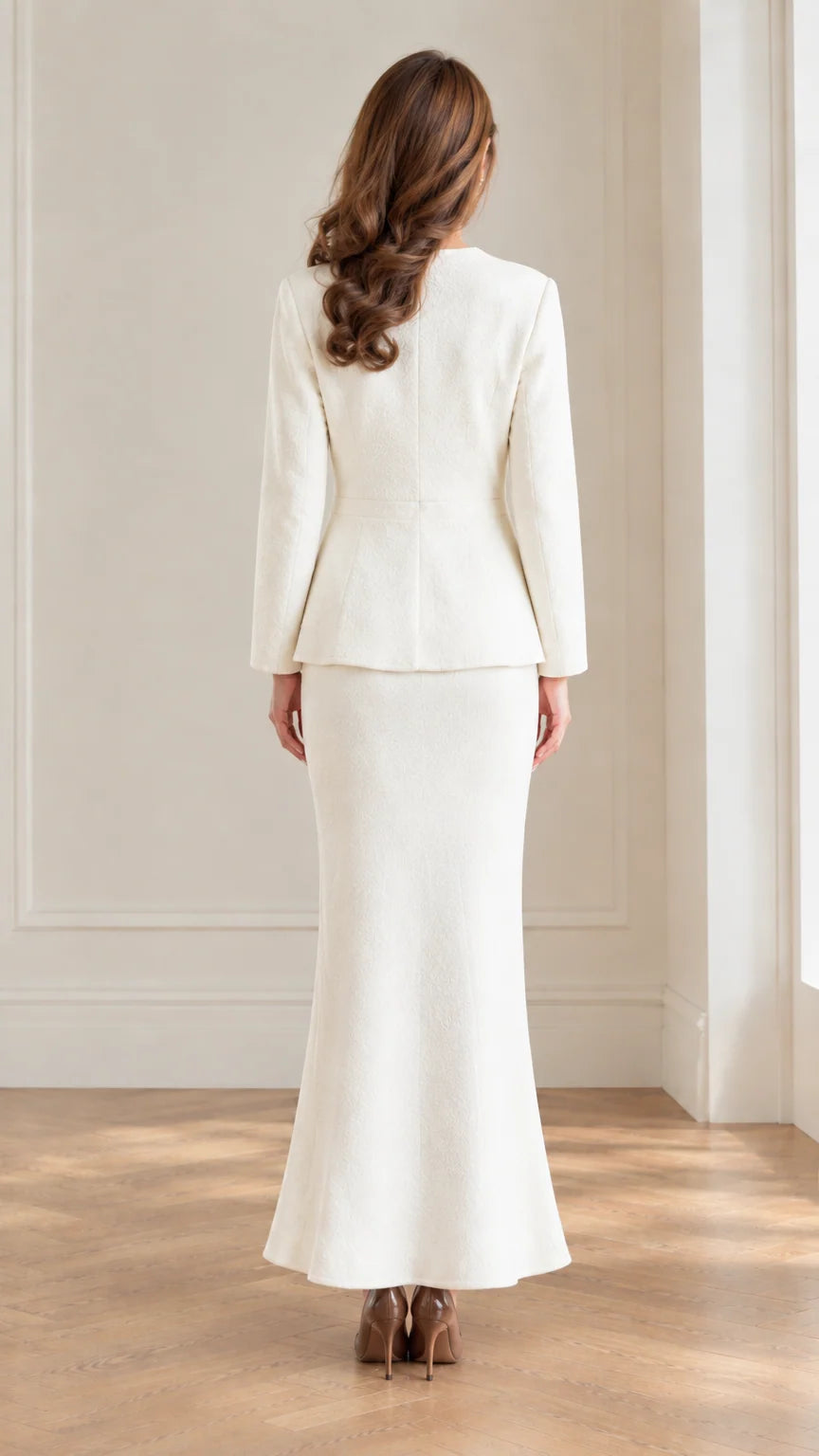 Back view of women's ivory fitted jacket and fluted maxi skirt set
