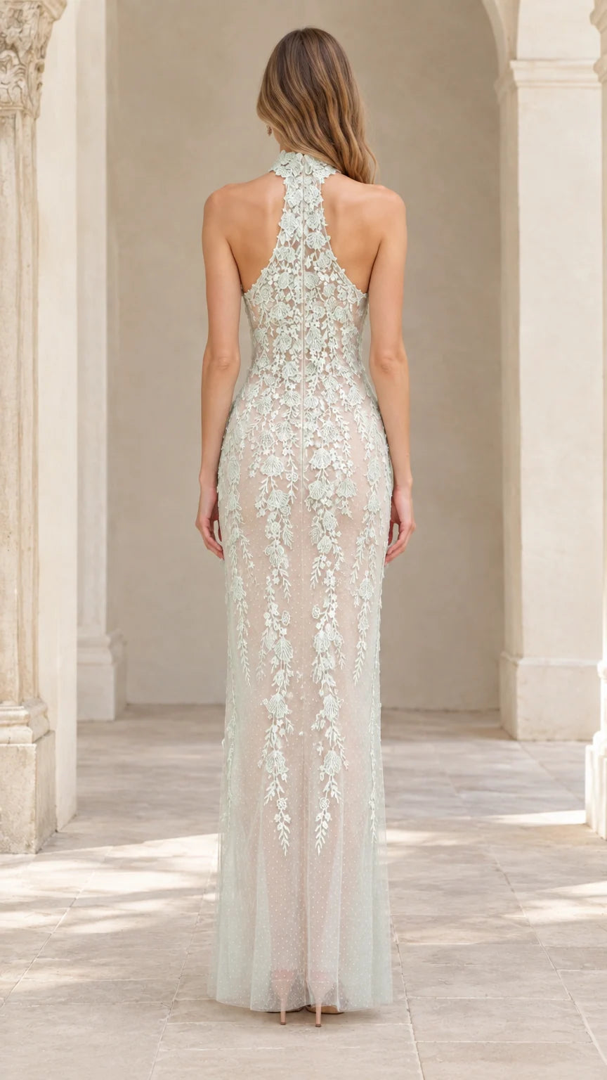 Back view of model in Sage Green halter floral lace formal gown
