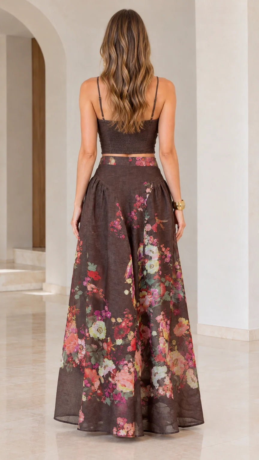 Back view of woman wearing chocolate brown ruched cami top and full floral maxi skirt