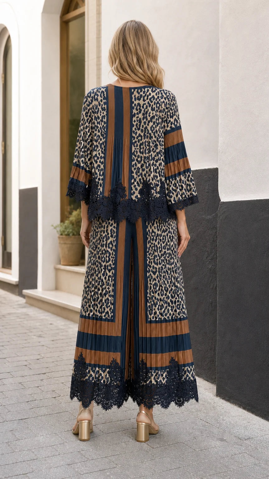 Back view of model wearing the pleated animal print top and wide-leg trousers