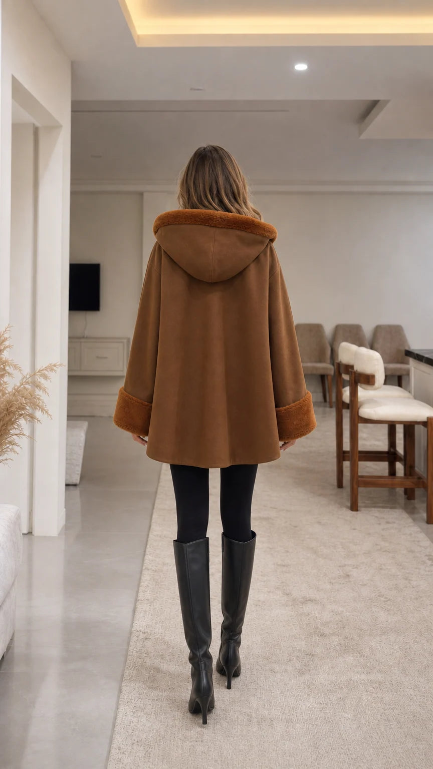 Back view of model wearing camel hooded cape coat showing hood detail