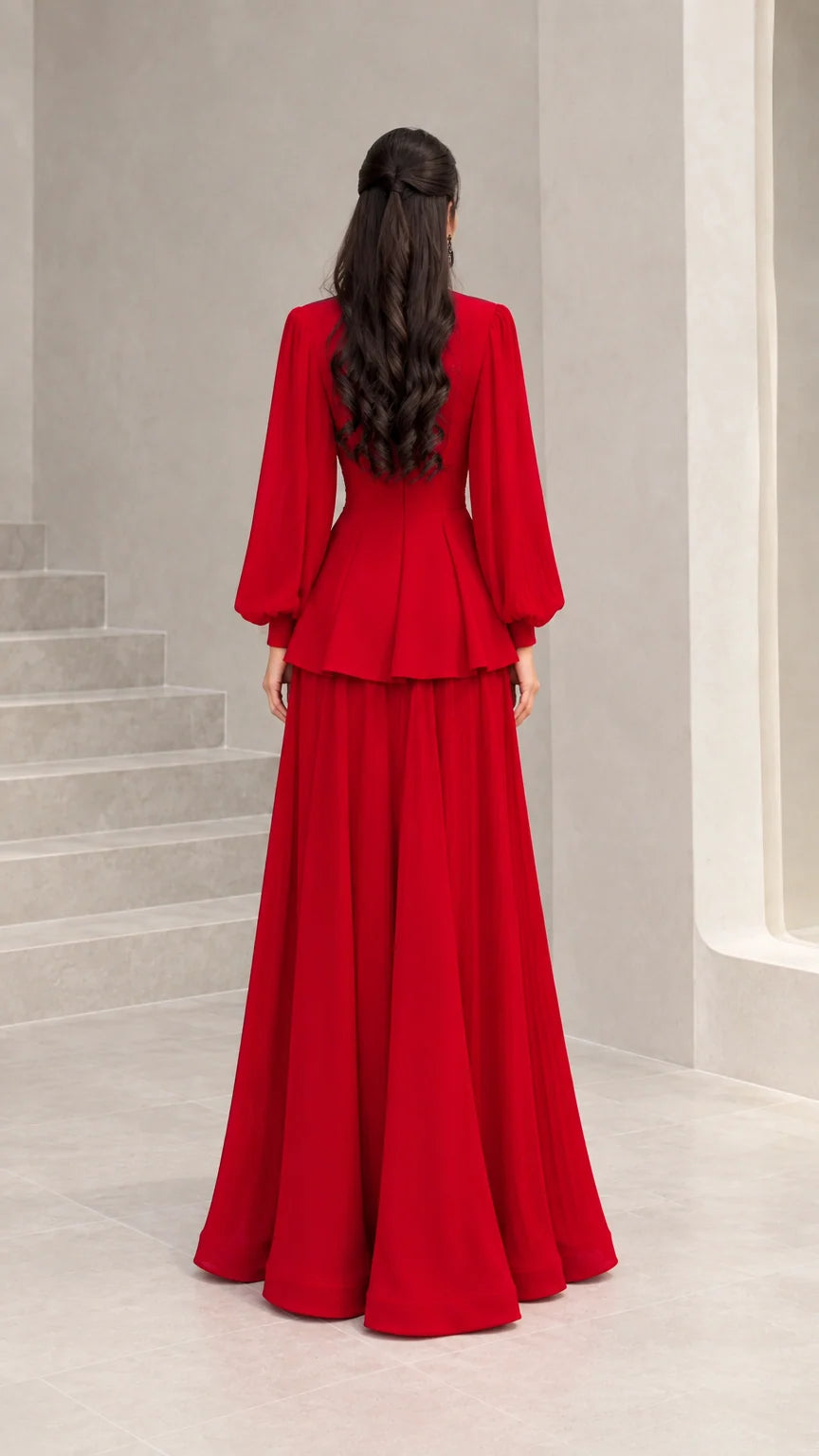 Back view of woman wearing red long-sleeve peplum evening dress