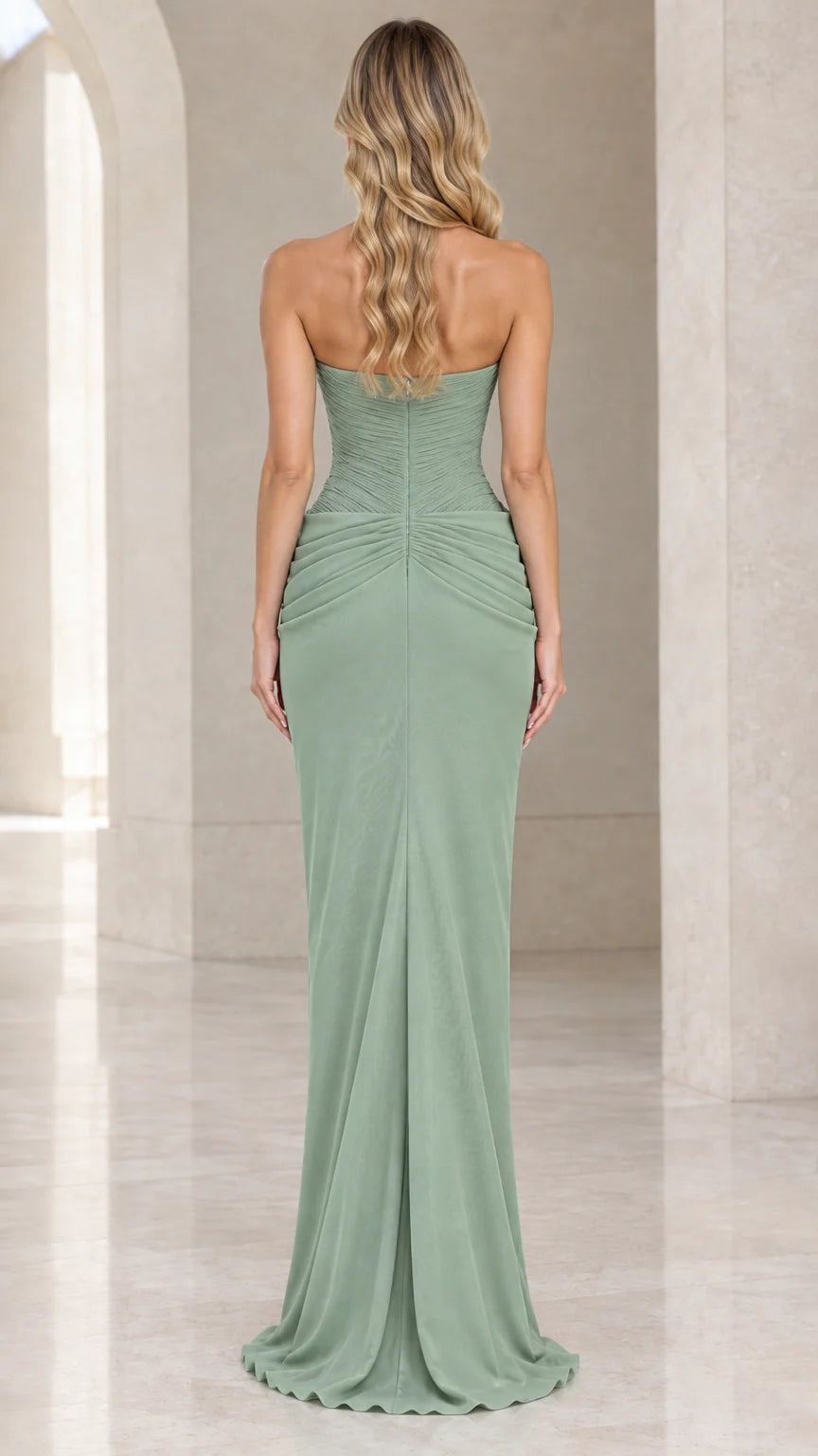 Back view of woman wearing floor-length strapless sage green formal gown