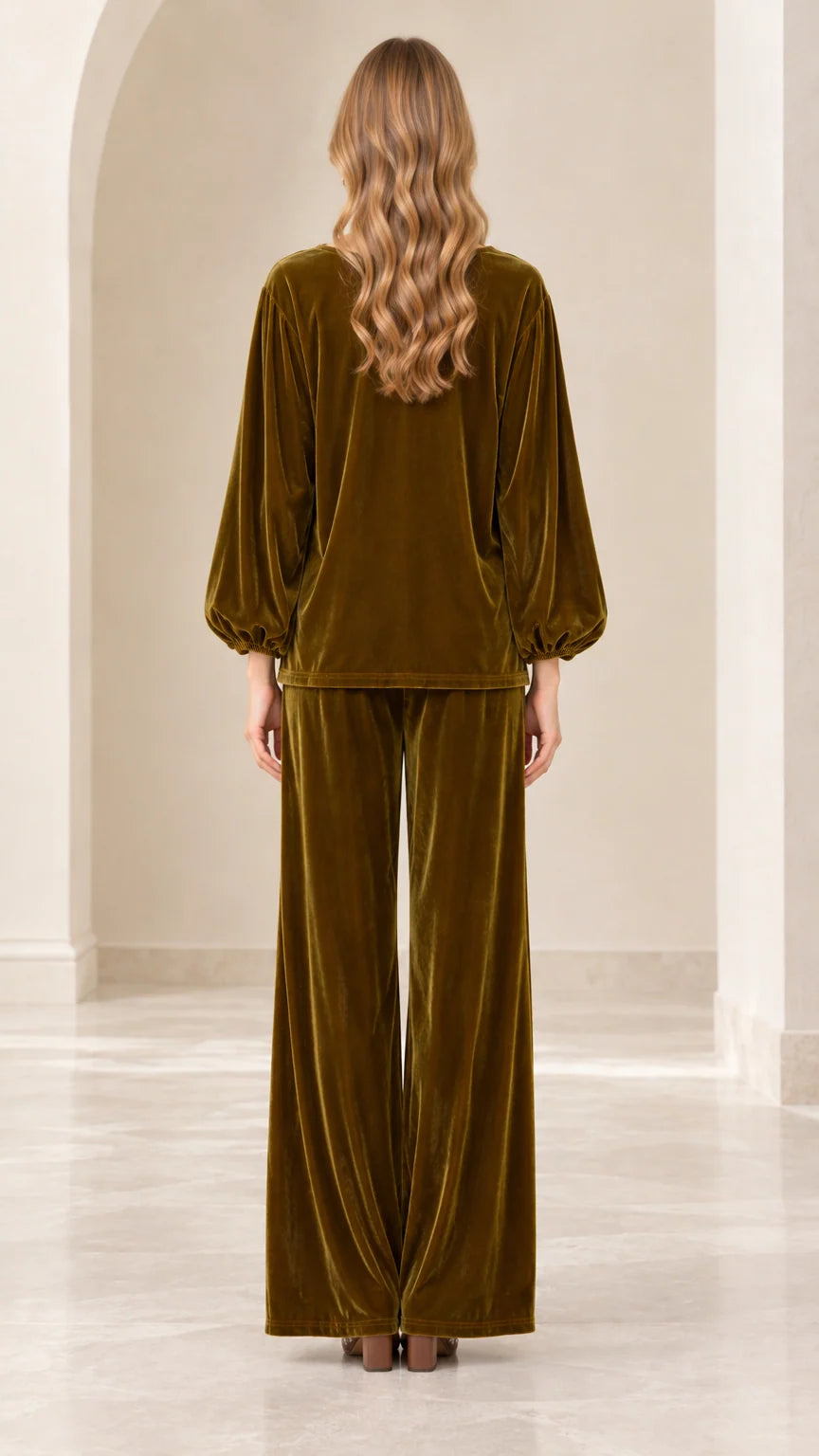 Back view of model wearing olive green velvet pant set