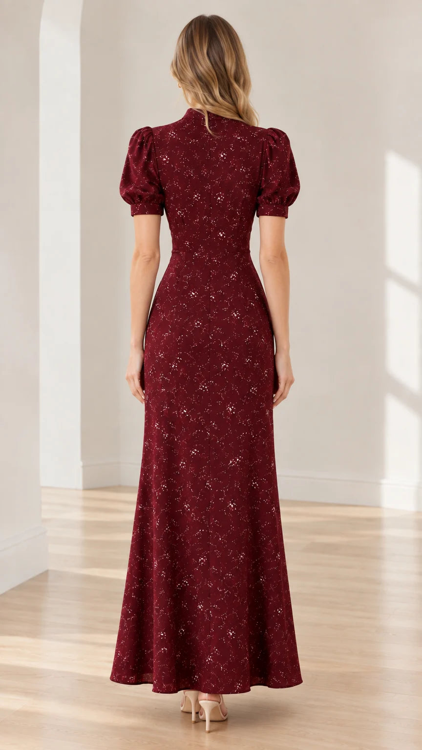 Back view of model wearing burgundy floral maxi dress showing seamless fit