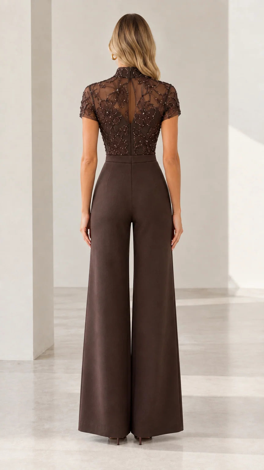 Back view of chocolate brown sheer back embroidered evening jumpsuit