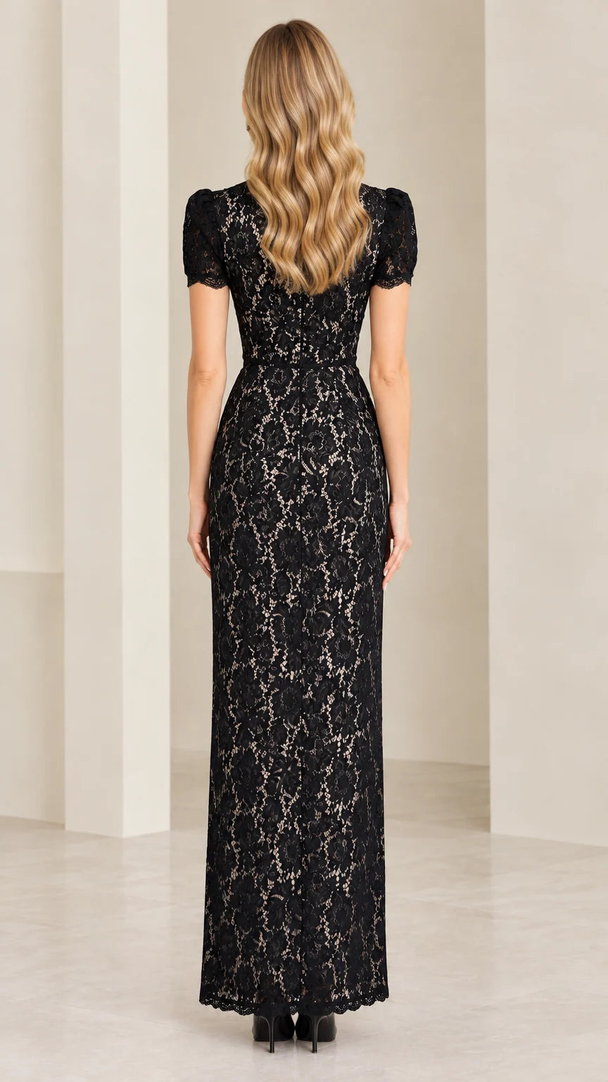 Back view of model showing tailored fit of black floral lace maxi dress