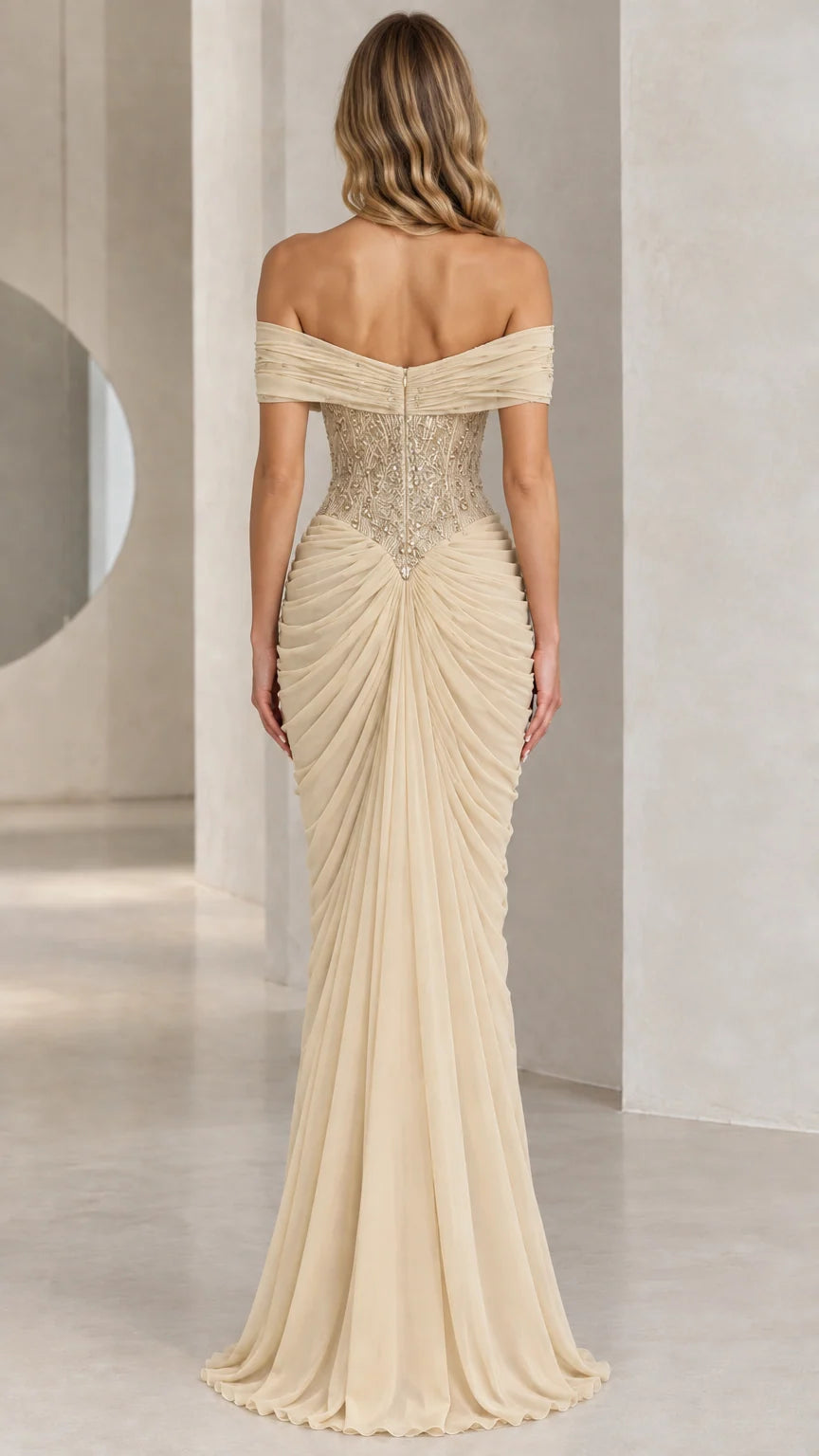 Back view of floor-length champagne formal gown with gathered ruched drape