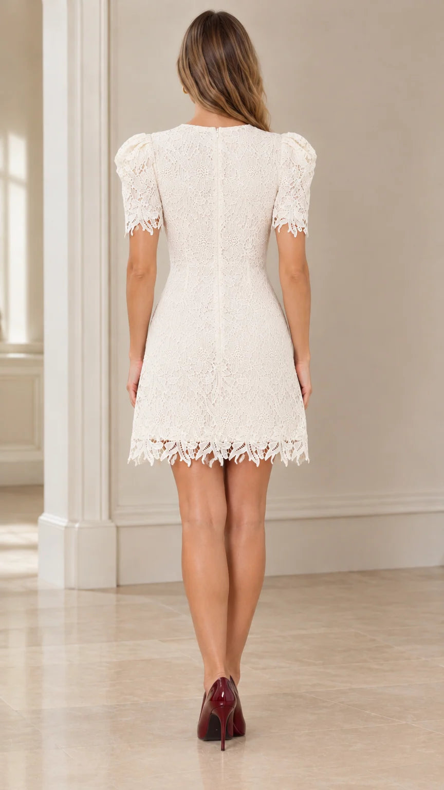 Back view of model wearing white short sleeve lace dress with back zipper
