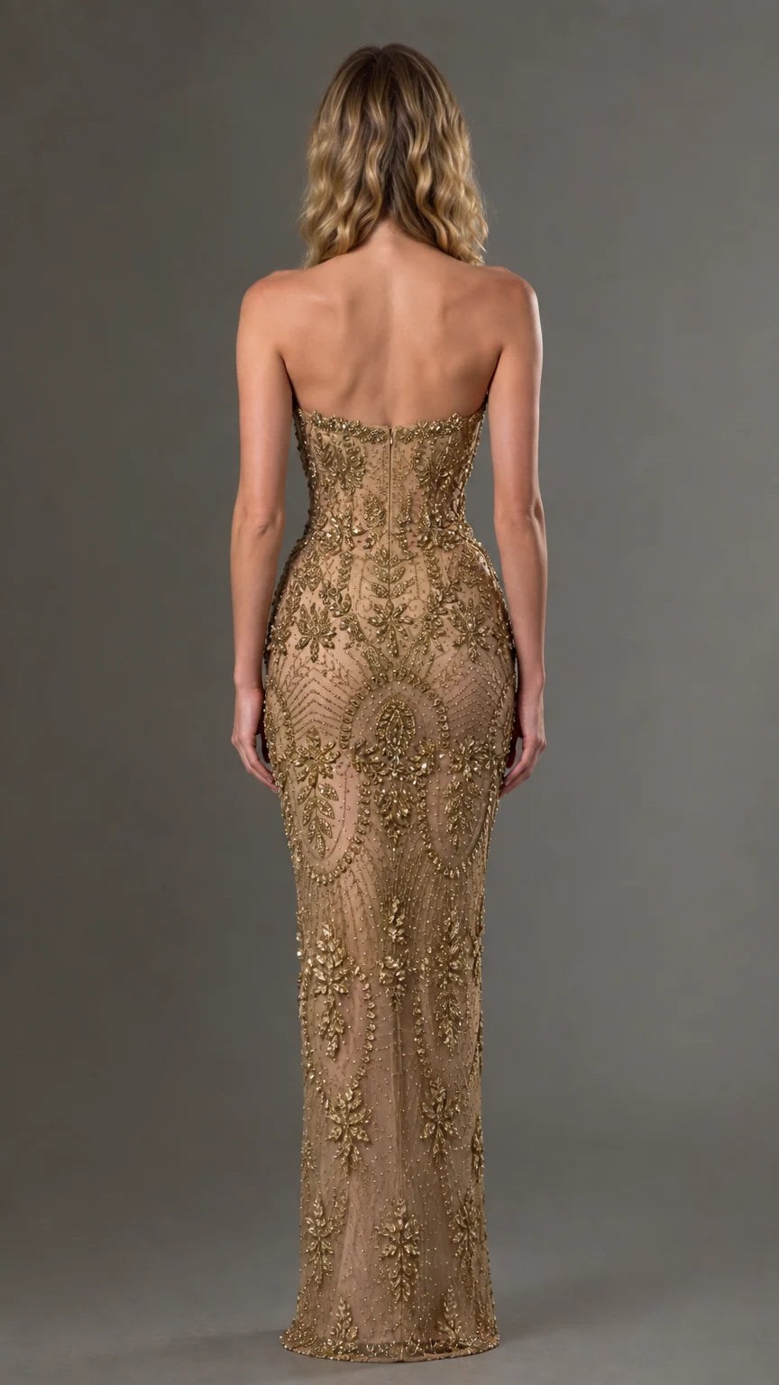 Back view of model in gold strapless beaded floor-length evening gown