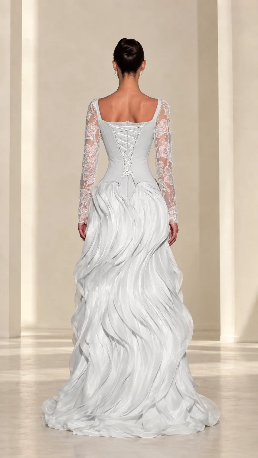 Back view of ice blue evening gown featuring adjustable lace-up corset and tiered ruffled train