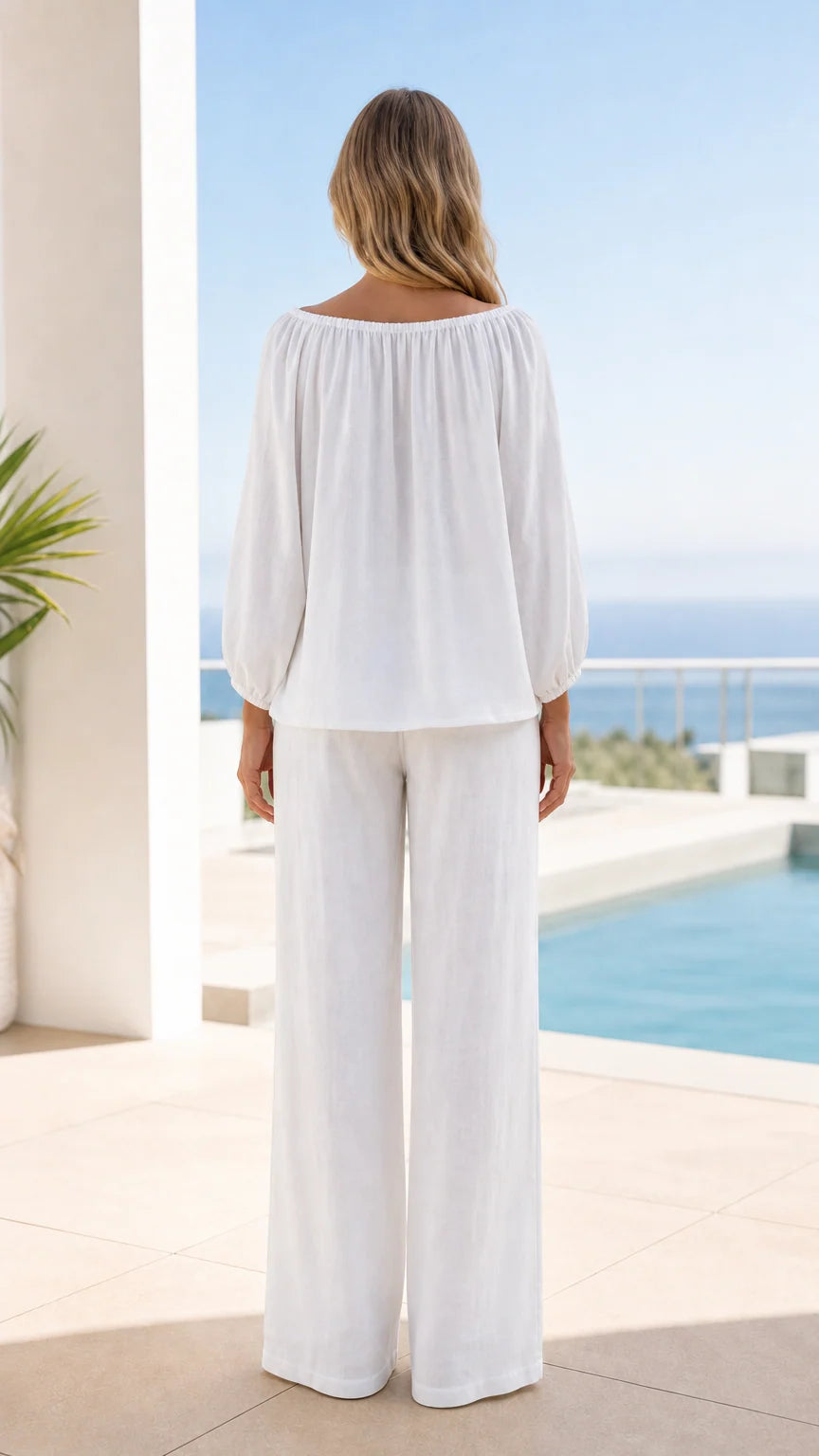 Back view of woman in white two-piece resort wear